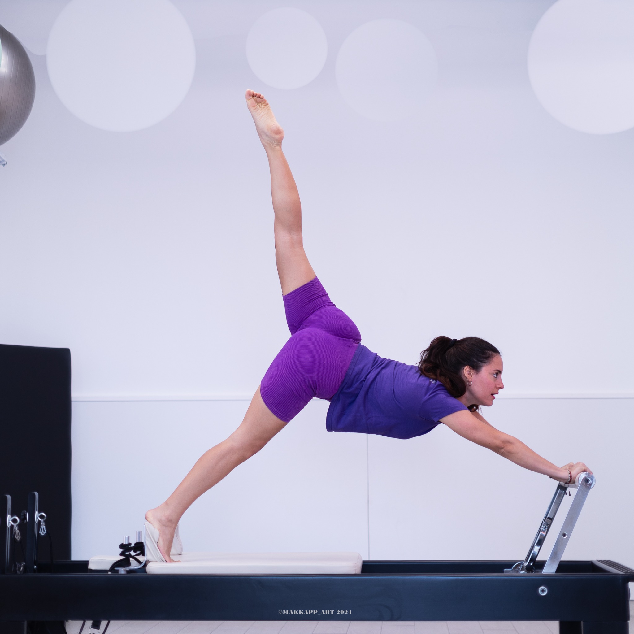 Lezione di Pilates con attrezzi